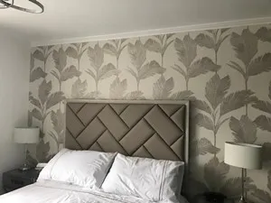 Bespoke upholstered headboard in a modern bedroom fabric